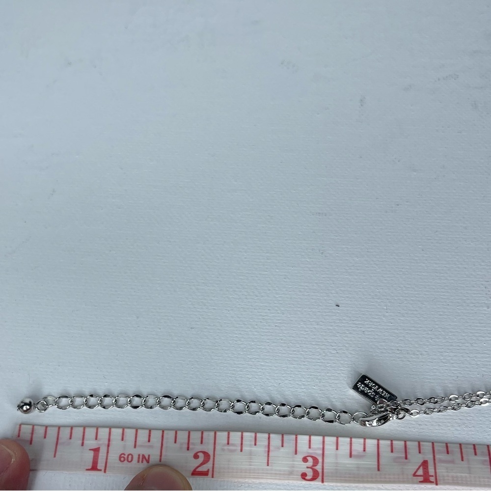 Kate Spade Infinity and Beyond Silver Tone Rhinestone Knot Pendant Necklace - Picture 11 of 12